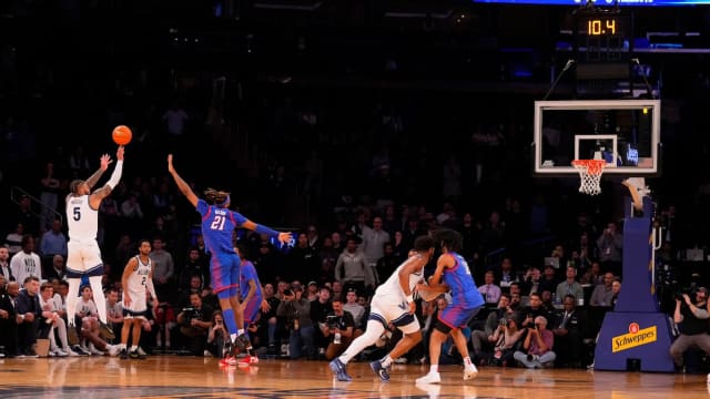 Villanova Wildcats guard Justin Moore (5) hits a three-point shot against DePaul during the second half at Madison Square Garden in New York City on March 13, 2024.